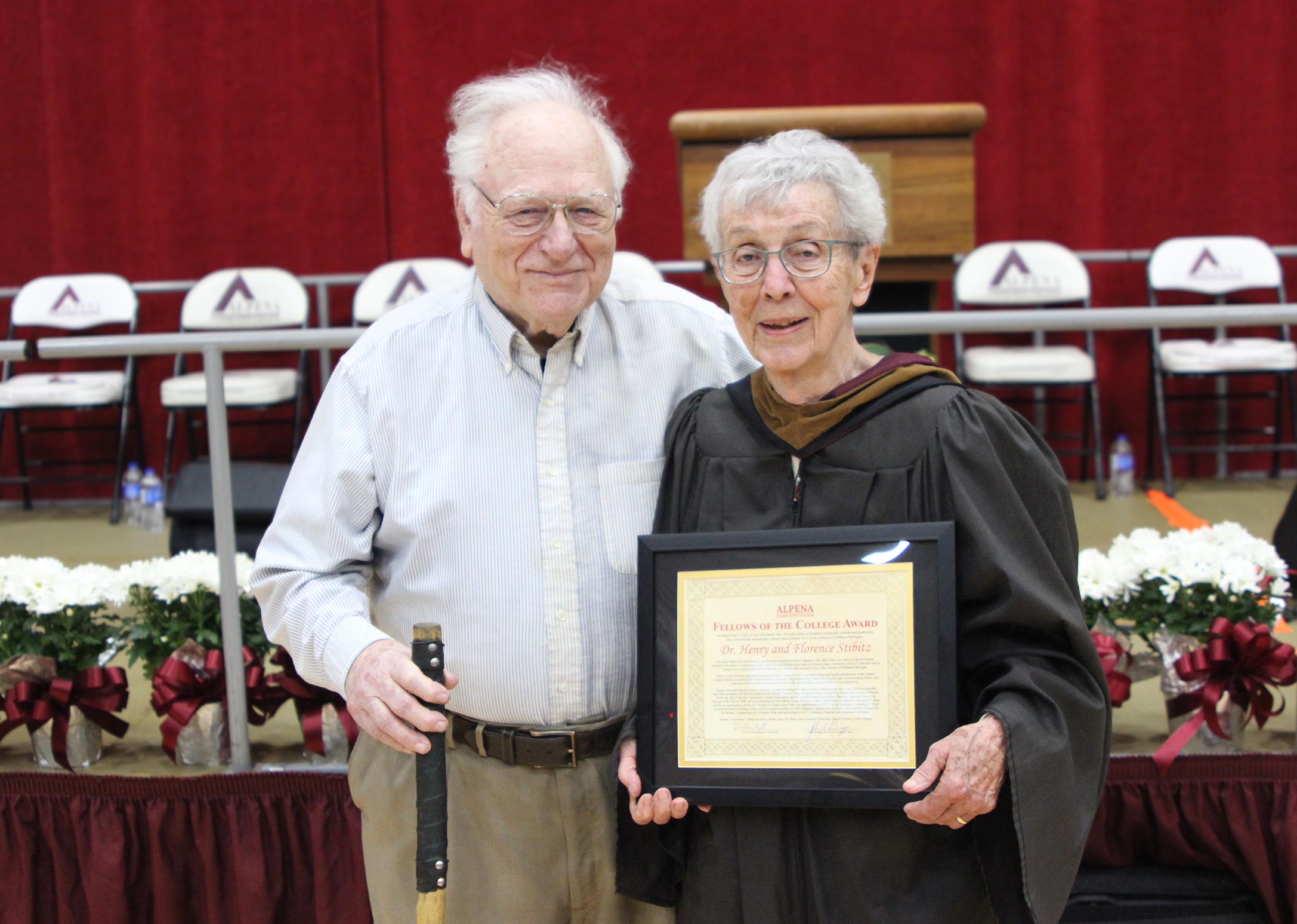 Dr. Henry and Florence Stibitz pose with their award at Graduation