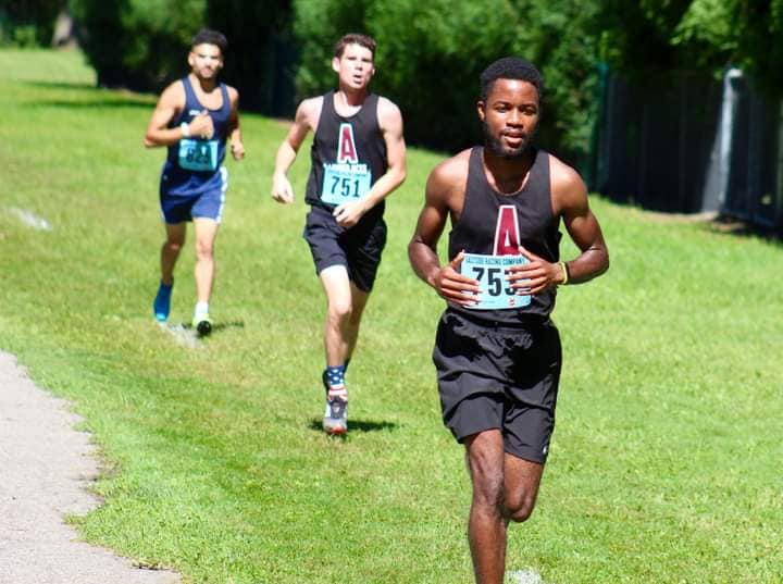 Musa competes in a cross country race