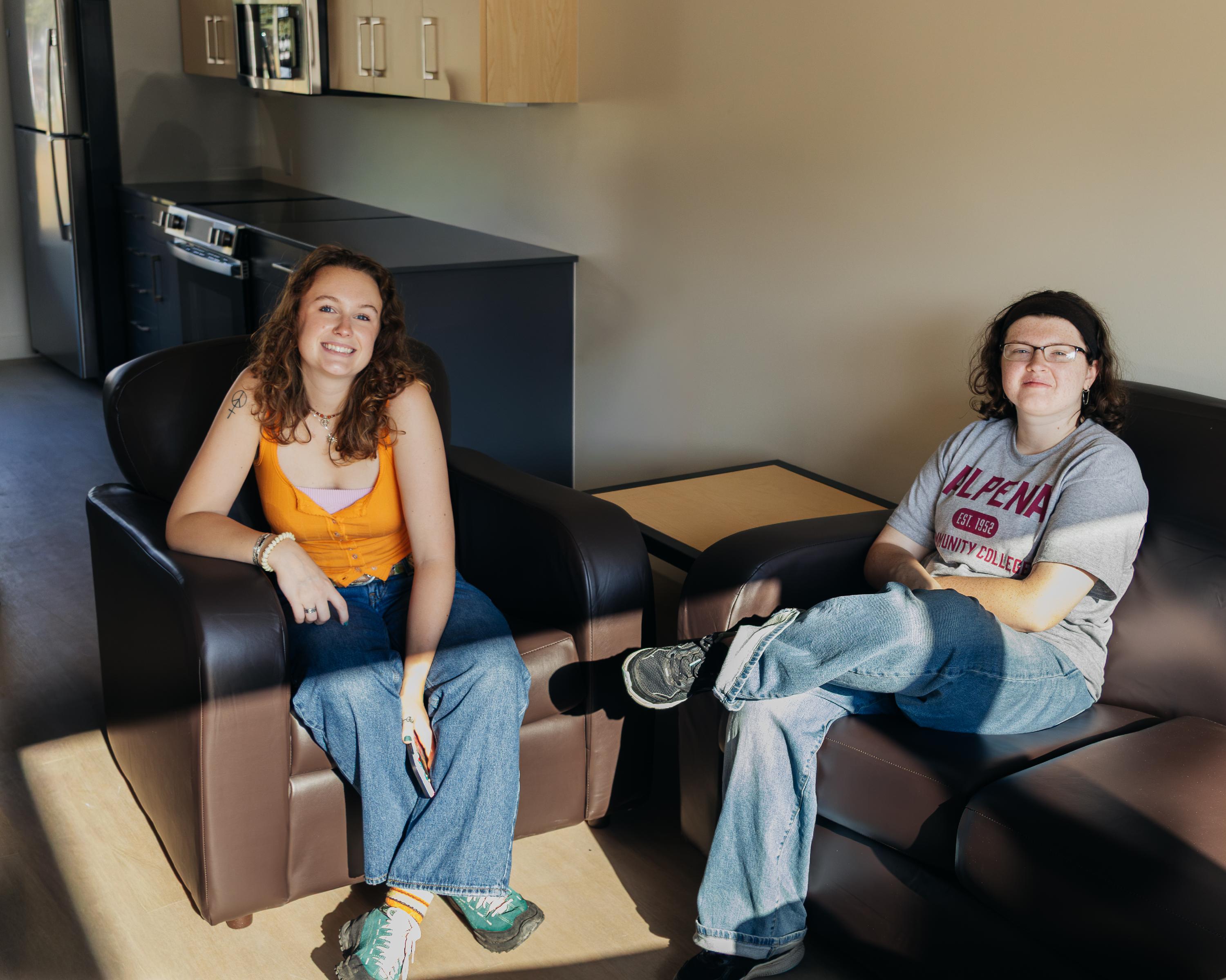 Students seated in apartment