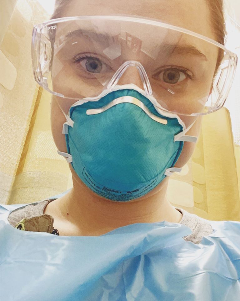 Katie Flemington takes a self picture while wearing protective equipment